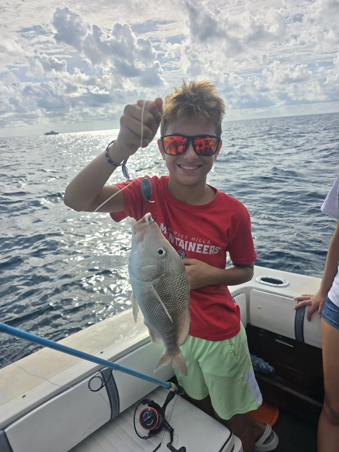 Young guest enjoying an Aquaholic fishing trip